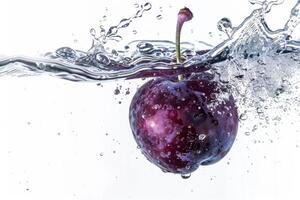 A purple cherry is being splashed into the water photo