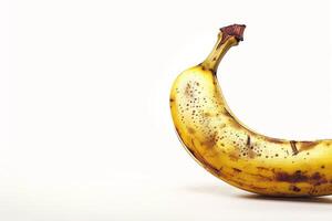 A banana that is brown and has spots on it photo