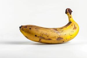 A banana with brown spots on it photo