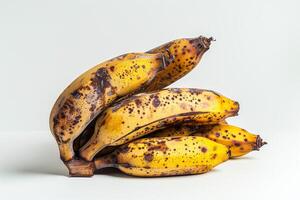 A bunch of bananas with brown spots on them photo