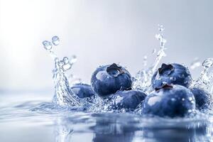 Blueberries are splashing into the water photo