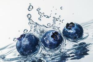 Blueberries splash in water photo