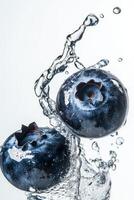 Blueberries in water with splash photo