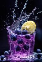 Blueberry lemonade with splash of water on black background photo