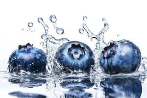 Three blueberries are splashing into the water photo
