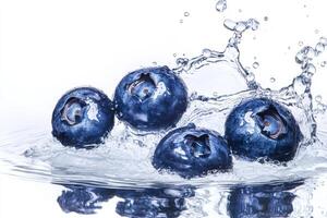 Blueberries splash in water on white background photo