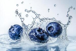 Blueberries splash in water photo