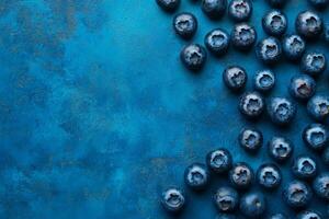 Blueberries on a blue background photo