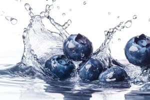 Blueberries are splashing into the water photo
