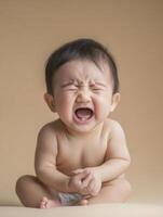A baby is crying and laughing in a studio photo