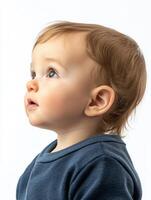 A baby is looking up at something photo