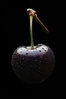 A cherry with water droplets on it photo