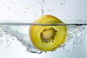Kiwi fruit falling into water photo