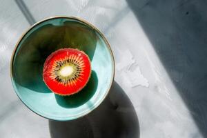 A bowl with a kiwi in it photo
