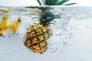 A pineapple is submerged in water photo