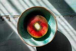 A bowl with a kiwi in it photo