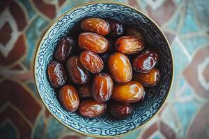 A bowl of dates on a table photo