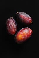 Three dates on a black background photo