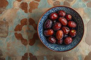 A bowl of dates on a table photo