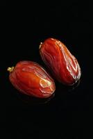 Two dates on a black background photo