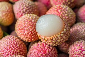 A bunch of lychees with a white center photo
