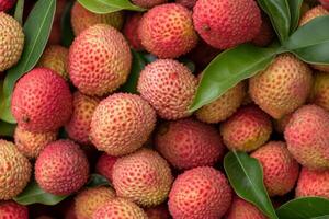 A pile of lychees with leaves photo
