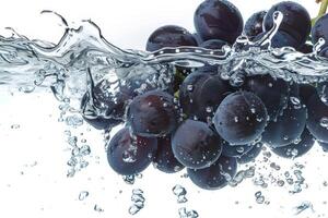 A bunch of grapes is being splashed into the water photo