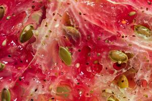 A close up of a slice of fruit with seeds photo