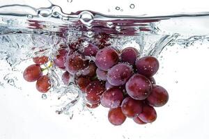Grapes in water with bubbles photo
