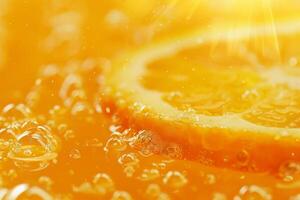 A slice of orange in a glass of water photo