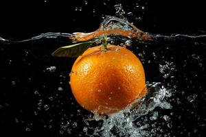 An orange is being splashed in water photo
