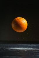 A single orange is floating in the air photo