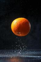 An orange is being thrown into the air photo