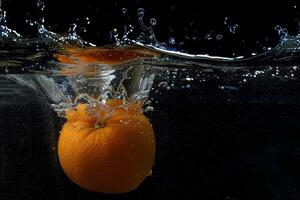 An orange in the water photo