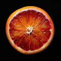 A cut orange on a black background photo