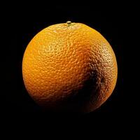 An orange is shown on a black background photo