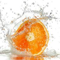 A half orange is being splashed with water photo
