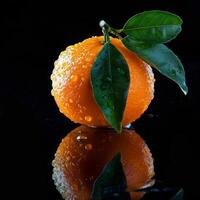 A single orange with a leaf on it photo