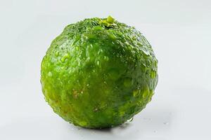 A lime with water drops photo