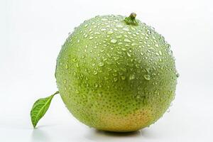 A green mango with water droplets on it photo