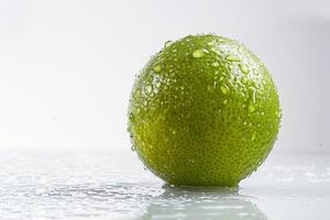 A lime with water droplets on it photo