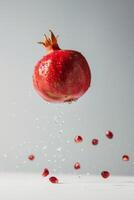 A pomegranate is being thrown into the air photo