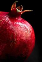 A close up of a red pomegranate photo