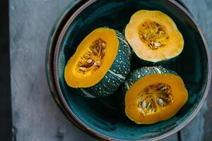 A bowl of squash with seeds and seeds photo