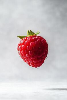A raspberry is flying in the air photo