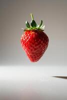 A strawberry is flying in the air photo