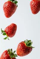 Strawberries falling in the air photo