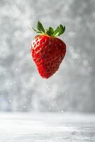 A strawberry is being thrown into the air photo