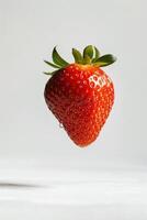 A strawberry is flying in the air photo