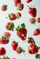 Strawberries falling into water photo